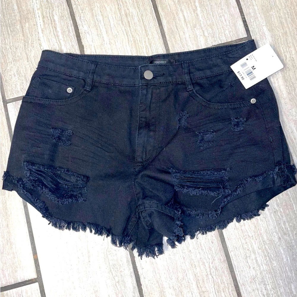 Distressed black shorts.